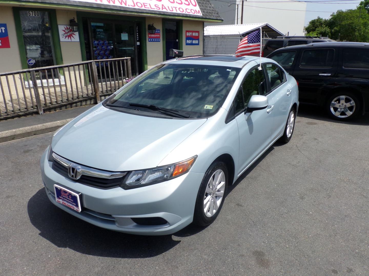 2012 Blue Honda Civic EX Sedan 5-Speed AT (19XFB2F83CE) with an 1.8L L4 SOHC 16V engine, 5-Speed Automatic transmission, located at 5700 Curlew Drive, Norfolk, VA, 23502, (757) 455-6330, 36.841885, -76.209412 - Photo#5