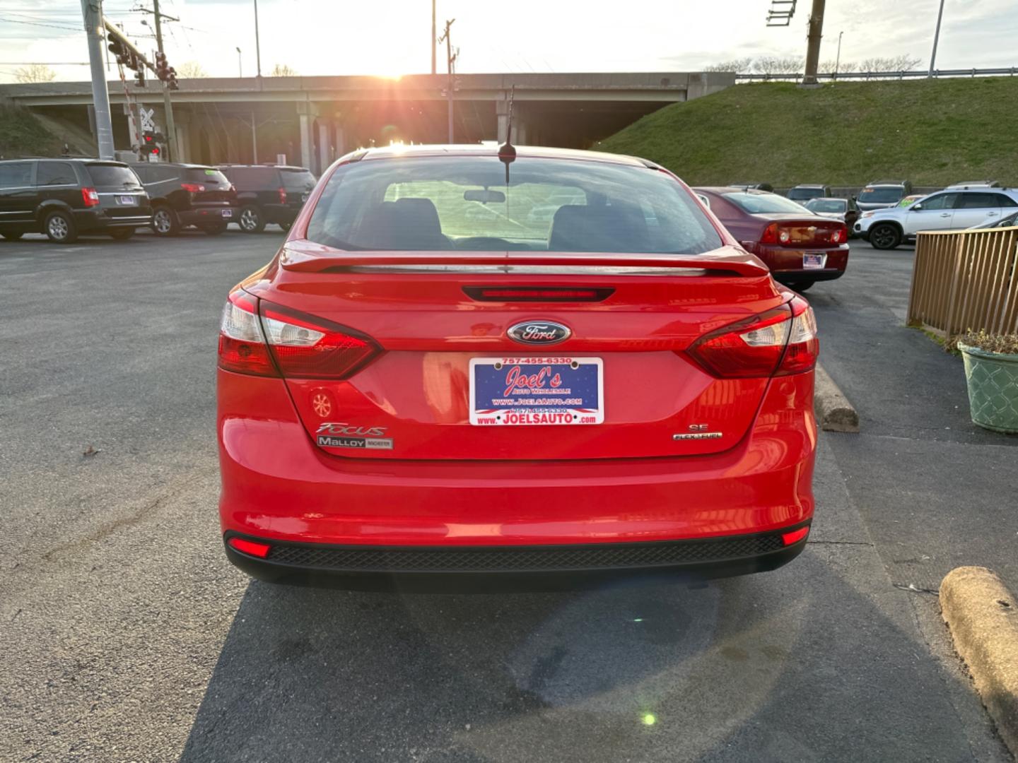 2012 Red Ford Focus SE Sedan (1FAHP3F26CL) with an 2.0L L4 DOHC 16V engine, located at 5700 Curlew Drive, Norfolk, VA, 23502, (757) 455-6330, 36.841885, -76.209412 - Photo#3