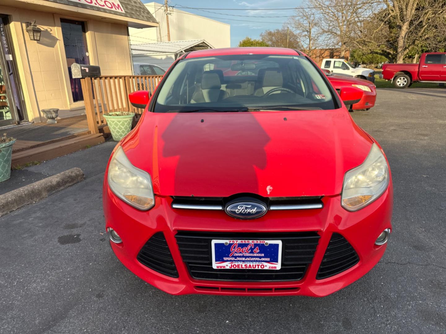 2012 Red Ford Focus SE Sedan (1FAHP3F26CL) with an 2.0L L4 DOHC 16V engine, located at 5700 Curlew Drive, Norfolk, VA, 23502, (757) 455-6330, 36.841885, -76.209412 - Photo#7