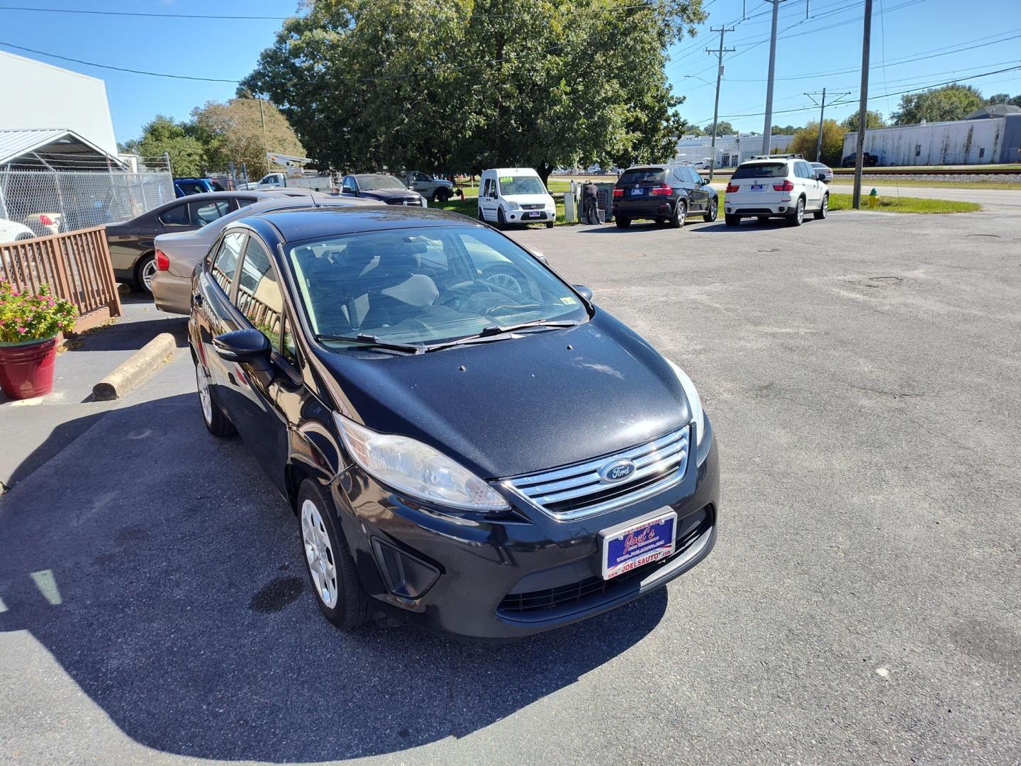 2013 Black Ford Fiesta SE Sedan (3FADP4BJ0DM) with an 1.6L L4 DOHC 16V engine, located at 5700 Curlew Drive, Norfolk, VA, 23502, (757) 455-6330, 36.841885, -76.209412 - Photo#4