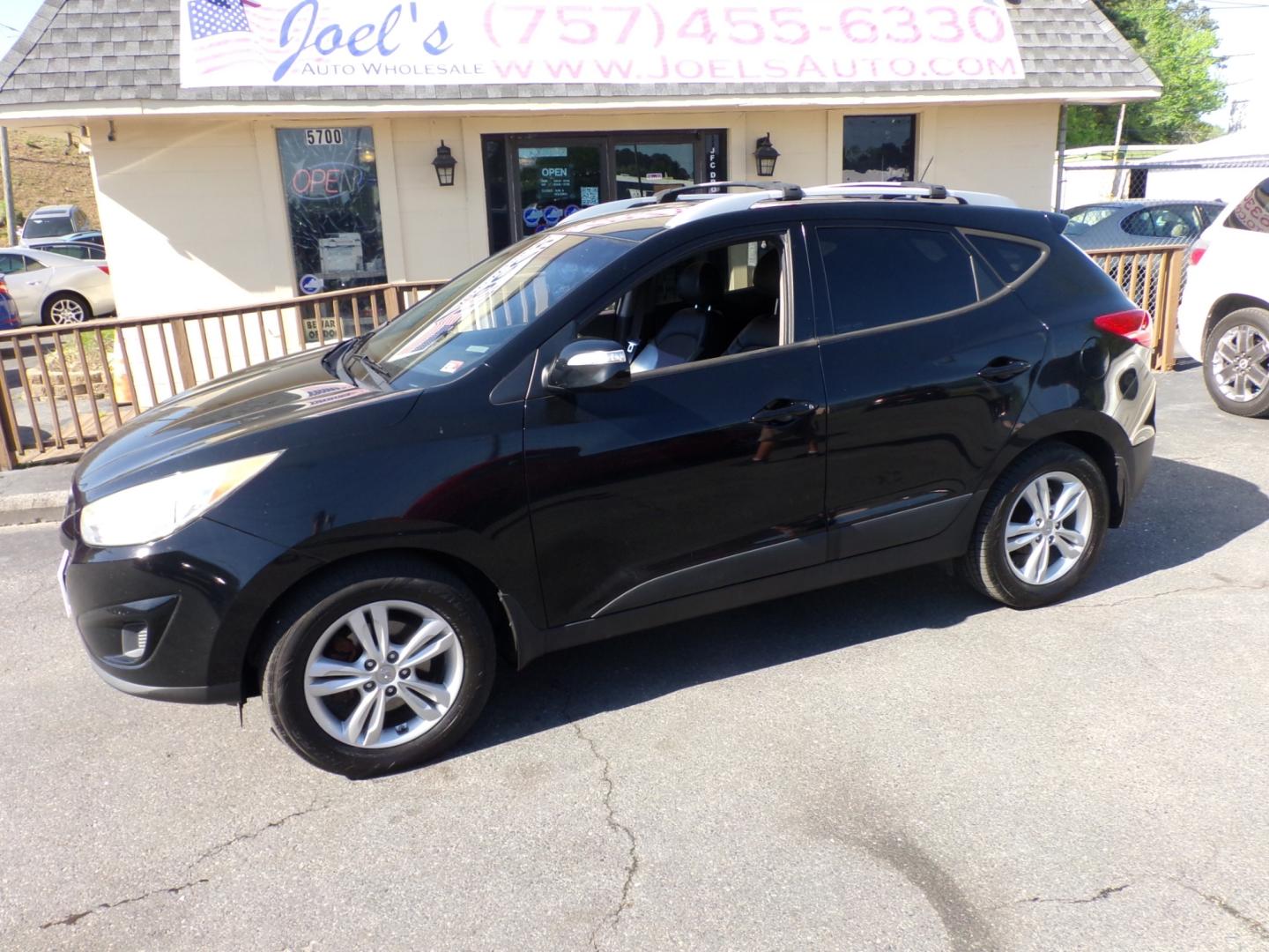 2012 Black Hyundai Tucson Limited 2WD (KM8JU3ACXCU) with an 2.4L L4 DOHC 16V engine, 6-Speed Automatic transmission, located at 5700 Curlew Drive, Norfolk, VA, 23502, (757) 455-6330, 36.841885, -76.209412 - Photo#0