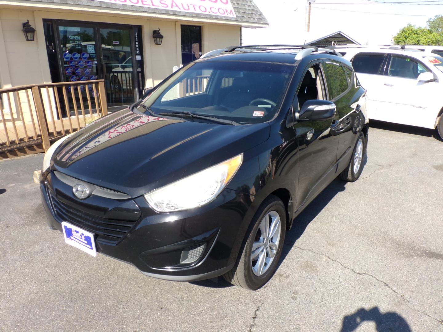 2012 Black Hyundai Tucson Limited 2WD (KM8JU3ACXCU) with an 2.4L L4 DOHC 16V engine, 6-Speed Automatic transmission, located at 5700 Curlew Drive, Norfolk, VA, 23502, (757) 455-6330, 36.841885, -76.209412 - Photo#4