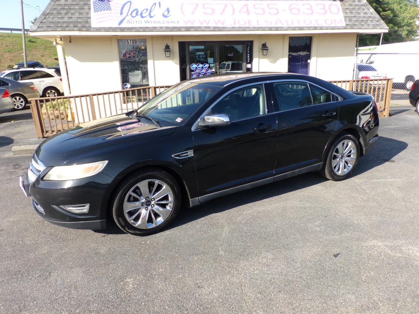 2011 Black Ford Taurus Limited FWD (1FAHP2FW0BG) with an 3.5L V6 DOHC 24V engine, 6-Speed Automatic transmission, located at 5700 Curlew Drive, Norfolk, VA, 23502, (757) 455-6330, 36.841885, -76.209412 - Photo#0