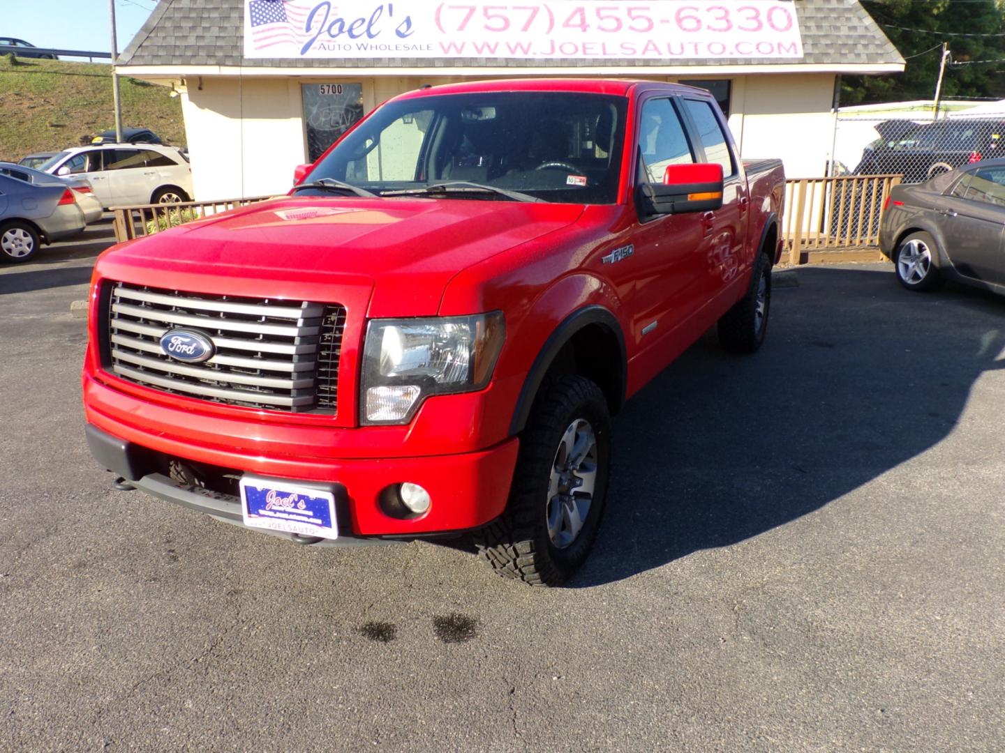 2011 Red Ford F-150 FX4 SuperCrew 5.5-ft. Bed 4WD (1FTFW1ET4BF) with an 3.5L V6 engine, 4-Speed Automatic transmission, located at 5700 Curlew Drive, Norfolk, VA, 23502, (757) 455-6330, 36.841885, -76.209412 - Photo#0