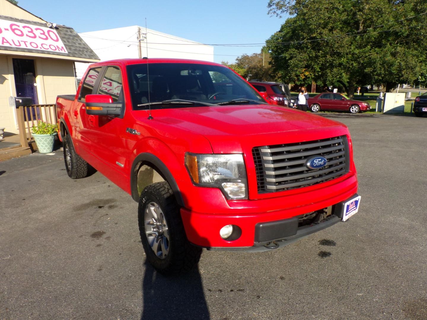 2011 Red Ford F-150 FX4 SuperCrew 5.5-ft. Bed 4WD (1FTFW1ET4BF) with an 3.5L V6 engine, 4-Speed Automatic transmission, located at 5700 Curlew Drive, Norfolk, VA, 23502, (757) 455-6330, 36.841885, -76.209412 - Photo#4