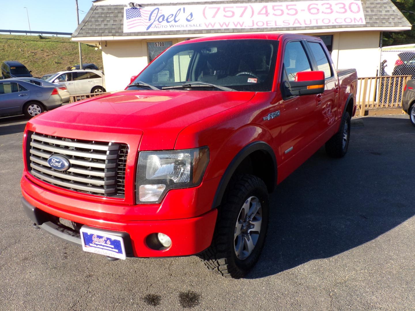 2011 Red Ford F-150 FX4 SuperCrew 5.5-ft. Bed 4WD (1FTFW1ET4BF) with an 3.5L V6 engine, 4-Speed Automatic transmission, located at 5700 Curlew Drive, Norfolk, VA, 23502, (757) 455-6330, 36.841885, -76.209412 - Photo#5