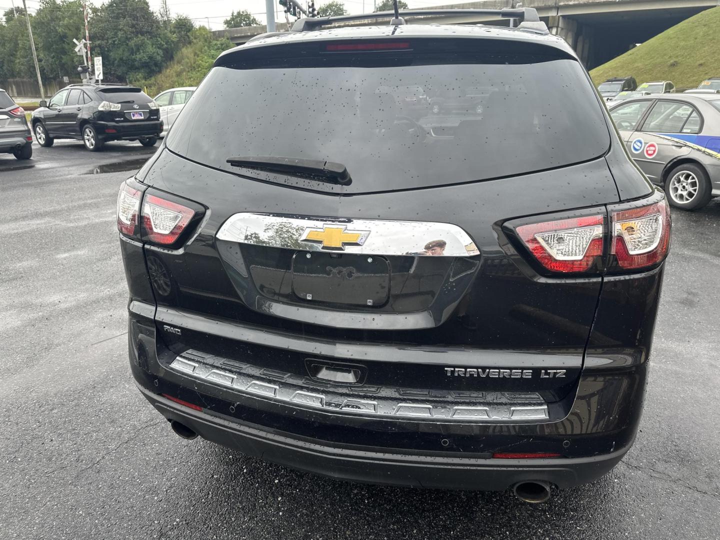 2013 Black Chevrolet Traverse LTZ AWD (1GNKVLKD5DJ) with an 3.6L V6 DOHC 24V engine, 6-Speed Automatic transmission, located at 5700 Curlew Drive, Norfolk, VA, 23502, (757) 455-6330, 36.841885, -76.209412 - Photo#2