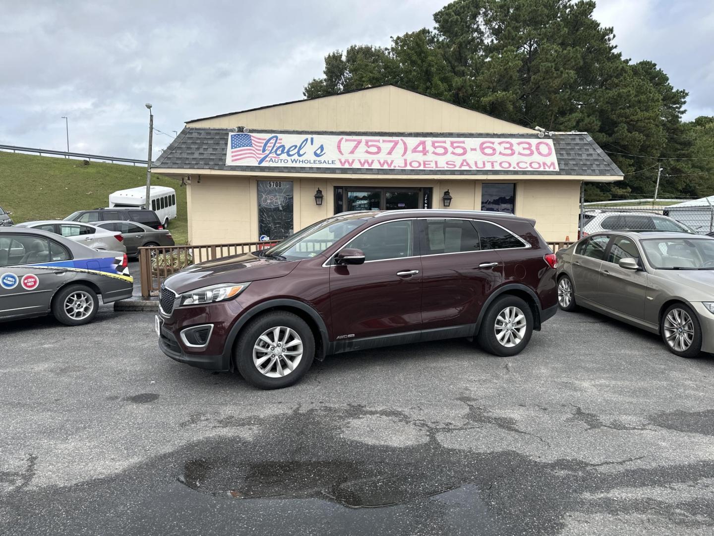 2017 Burgundy Kia Sorento LX V6 AWD (5XYPGDA56HG) with an 3.3L V6 DOHC 24V engine, 6A transmission, located at 5700 Curlew Drive, Norfolk, VA, 23502, (757) 455-6330, 36.841885, -76.209412 - Photo#0