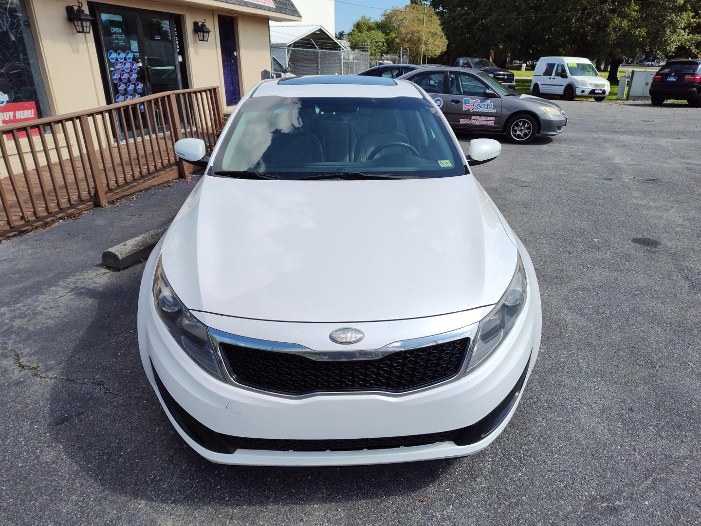 2013 WHITE Kia Optima LX MT (KNAGM4A79D5) with an 2.4L L4 DOHC 16V engine, 6-Speed Manual transmission, located at 5700 Curlew Drive, Norfolk, VA, 23502, (757) 455-6330, 36.841885, -76.209412 - Photo#3