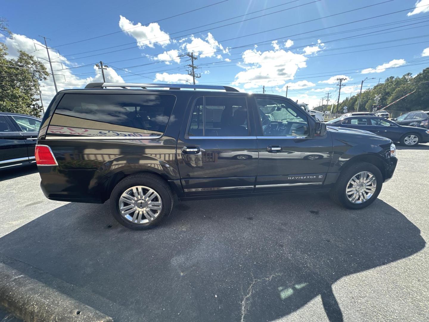 2012 Black Lincoln Navigator L 4WD (5LMJJ3J54CE) with an 5.4L V8 SOHC 24V engine, 6-Speed Automatic transmission, located at 5700 Curlew Drive, Norfolk, VA, 23502, (757) 455-6330, 36.841885, -76.209412 - Photo#3