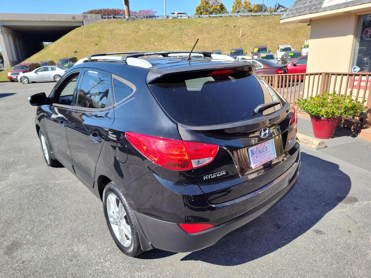 2013 Black Hyundai Tucson Limited 2WD (KM8JU3ACXDU) with an 2.4L L4 DOHC 16V engine, 6-Speed Automatic transmission, located at 5700 Curlew Drive, Norfolk, VA, 23502, (757) 455-6330, 36.841885, -76.209412 - Photo#12