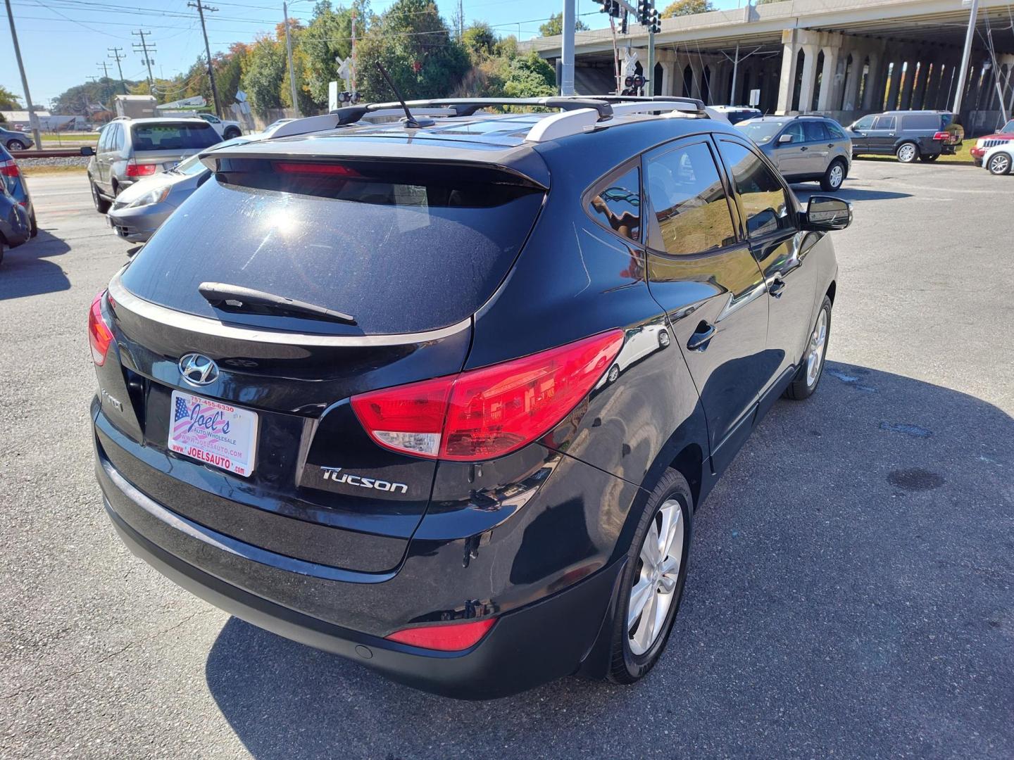 2013 Black Hyundai Tucson Limited 2WD (KM8JU3ACXDU) with an 2.4L L4 DOHC 16V engine, 6-Speed Automatic transmission, located at 5700 Curlew Drive, Norfolk, VA, 23502, (757) 455-6330, 36.841885, -76.209412 - Photo#15