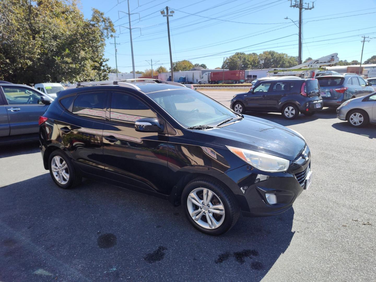 2013 Black Hyundai Tucson Limited 2WD (KM8JU3ACXDU) with an 2.4L L4 DOHC 16V engine, 6-Speed Automatic transmission, located at 5700 Curlew Drive, Norfolk, VA, 23502, (757) 455-6330, 36.841885, -76.209412 - Photo#17