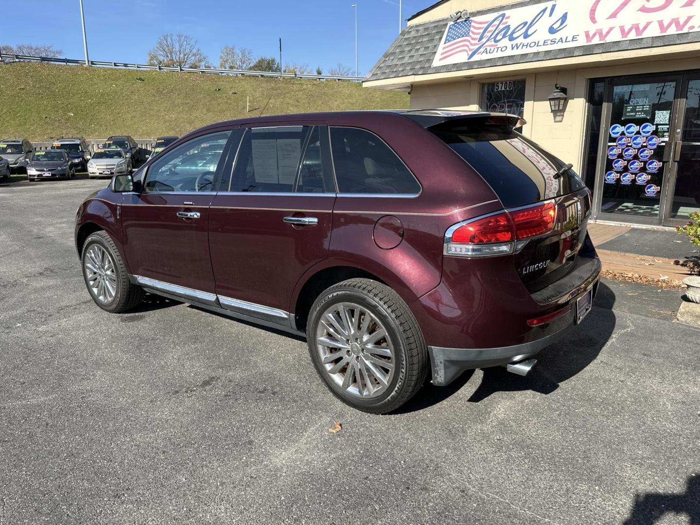 2011 Red Lincoln MKX FWD (2LMDJ6JK7BB) with an 3.7L V6 DOHC 24V engine, 6-Speed Automatic transmission, located at 5700 Curlew Drive, Norfolk, VA, 23502, (757) 455-6330, 36.841885, -76.209412 - Photo#1