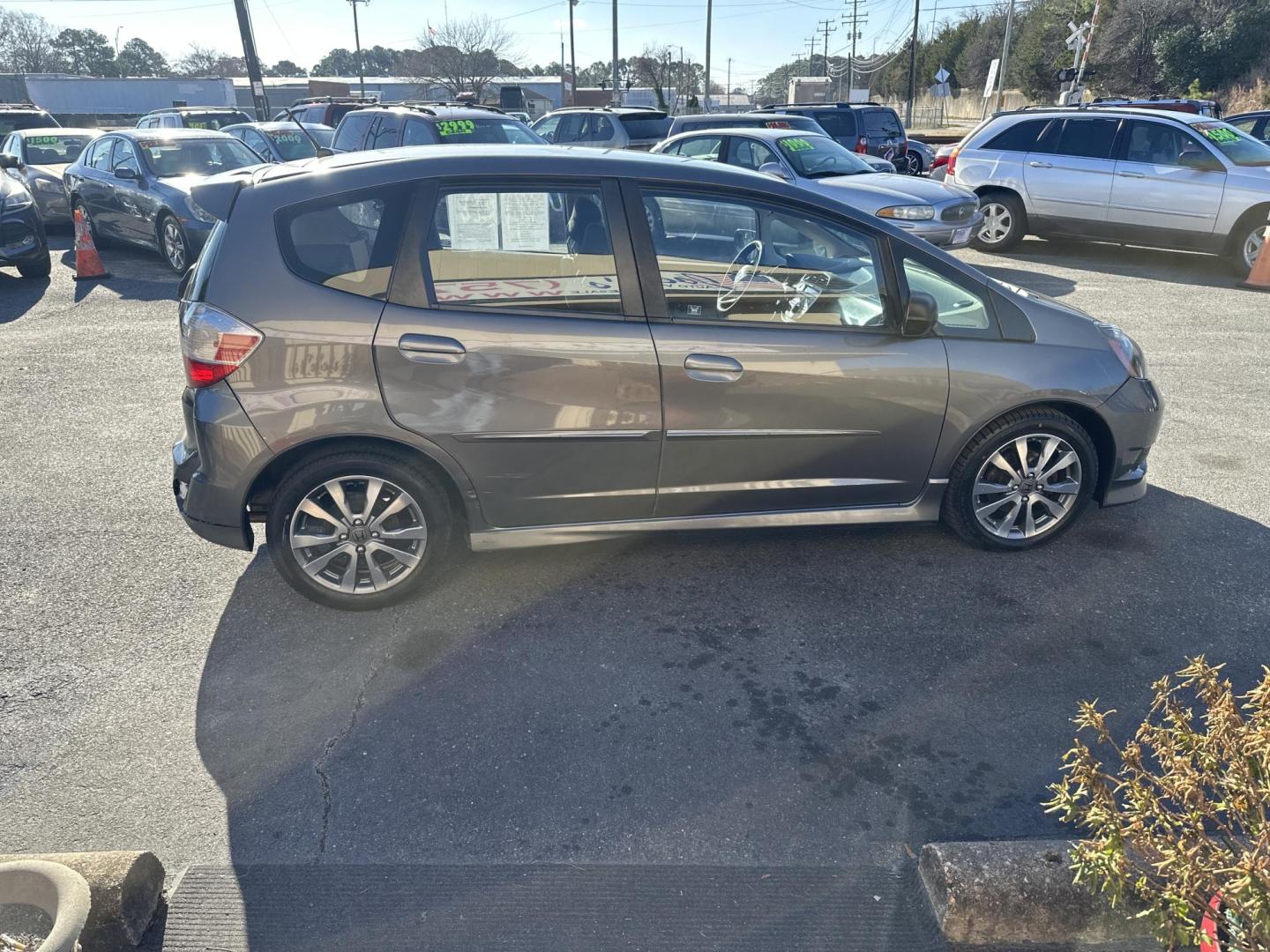 2012 Gray Honda Fit Sport 5-Speed AT (JHMGE8H54CC) with an 1.5L L4 SOHC 16V engine, 5-Speed Automatic transmission, located at 5700 Curlew Drive, Norfolk, VA, 23502, (757) 455-6330, 36.841885, -76.209412 - Photo#3