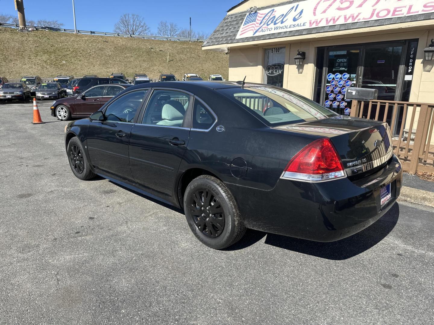 2009 Black Chevrolet Impala LS (2G1WB57K391) with an 3.5L V6 OHV 16V FFV engine, 4-Speed Automatic transmission, located at 5700 Curlew Drive, Norfolk, VA, 23502, (757) 455-6330, 36.841885, -76.209412 - Photo#1