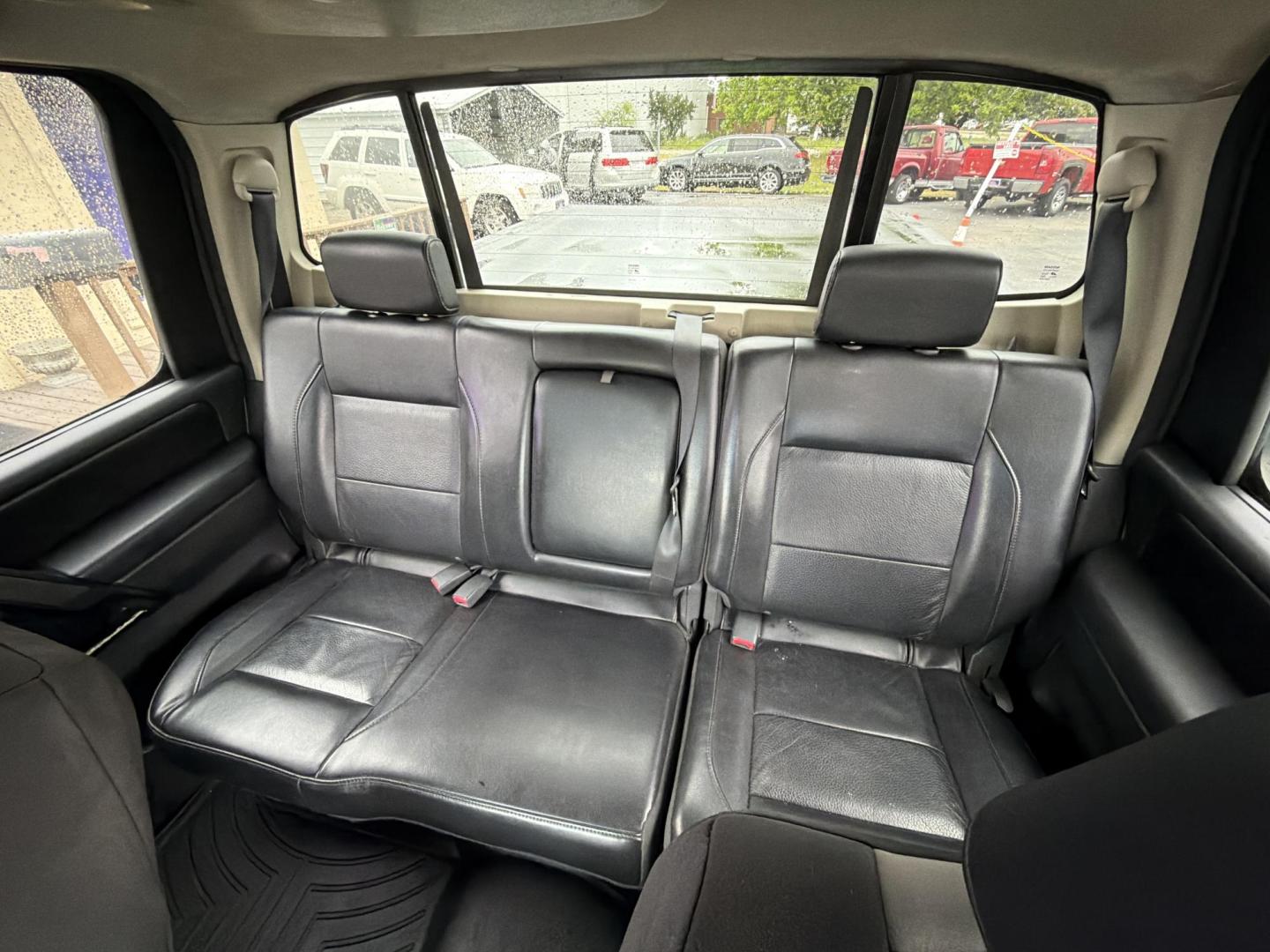 2008 Burgundy Nissan Titan LE Crew Cab 4WD SWB (1N6BA07C48N) with an 5.6L V8 DOHC 32V FFV engine, 5-Speed Automatic transmission, located at 5700 Curlew Drive, Norfolk, VA, 23502, (757) 455-6330, 36.841885, -76.209412 - Photo#9