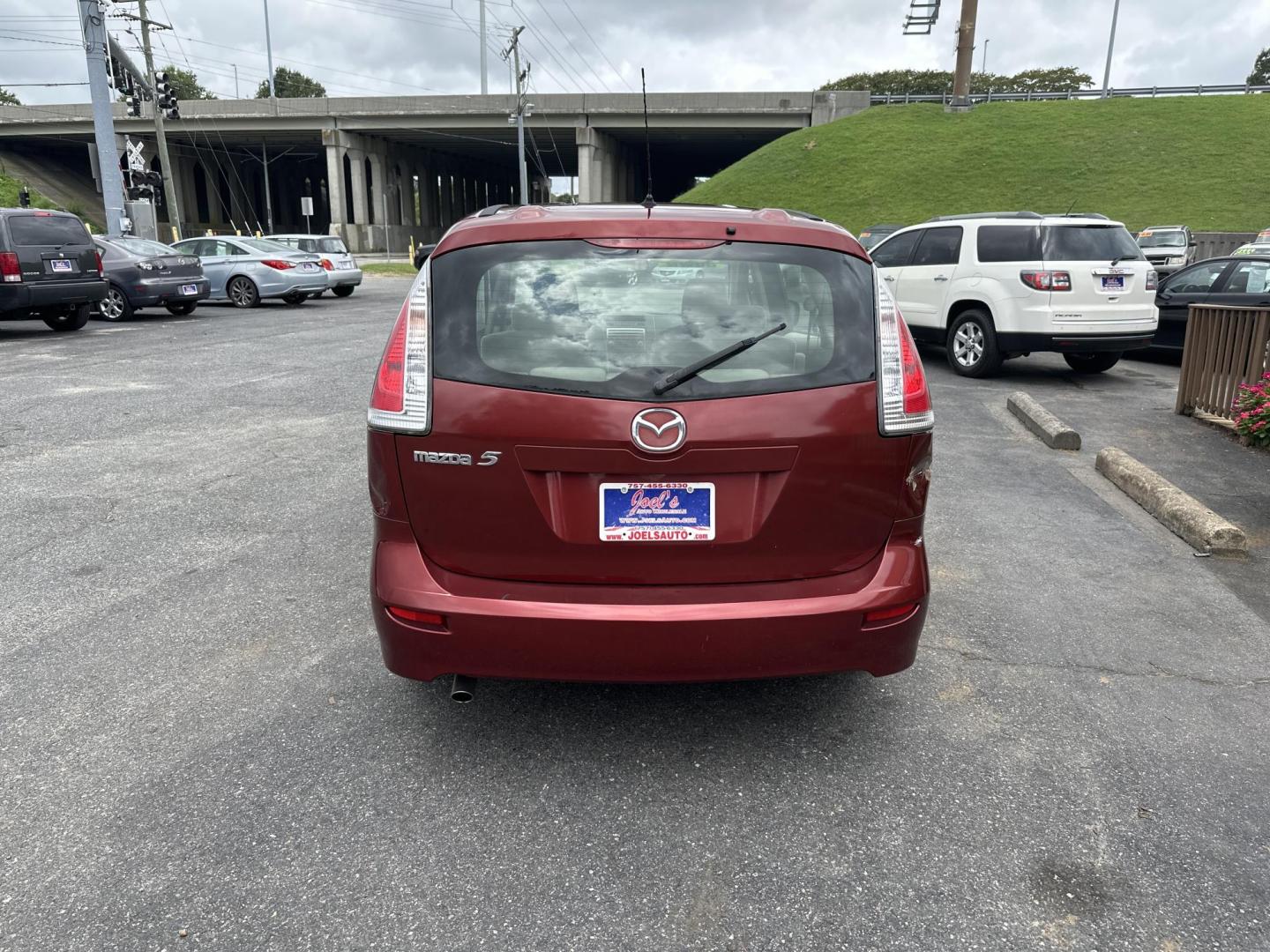 2010 Red Mazda MAZDA5 Grand Touring (JM1CR2W32A0) with an 2.3L L4 DOHC 16V engine, located at 5700 Curlew Drive, Norfolk, VA, 23502, (757) 455-6330, 36.841885, -76.209412 - Photo#2