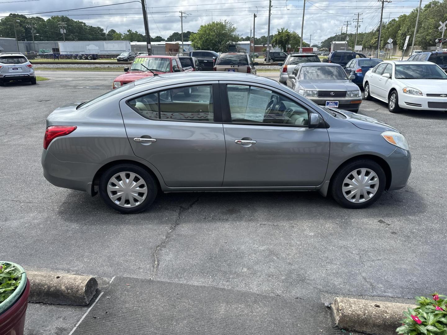 2012 Gray Nissan Versa 1.6 S Sedan (3N1CN7AP0CL) with an 1.6L L4 DOHC 16V engine, Automatic transmission, located at 5700 Curlew Drive, Norfolk, VA, 23502, (757) 455-6330, 36.841885, -76.209412 - Photo#3