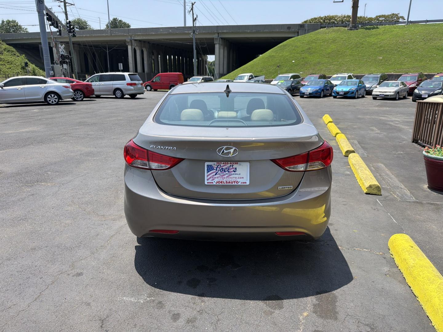 2013 Gold Hyundai Elantra Limited (5NPDH4AE4DH) with an 1.8L L4 DOHC 16V engine, 6-Speed Automatic transmission, located at 5700 Curlew Drive, Norfolk, VA, 23502, (757) 455-6330, 36.841885, -76.209412- Photo#2