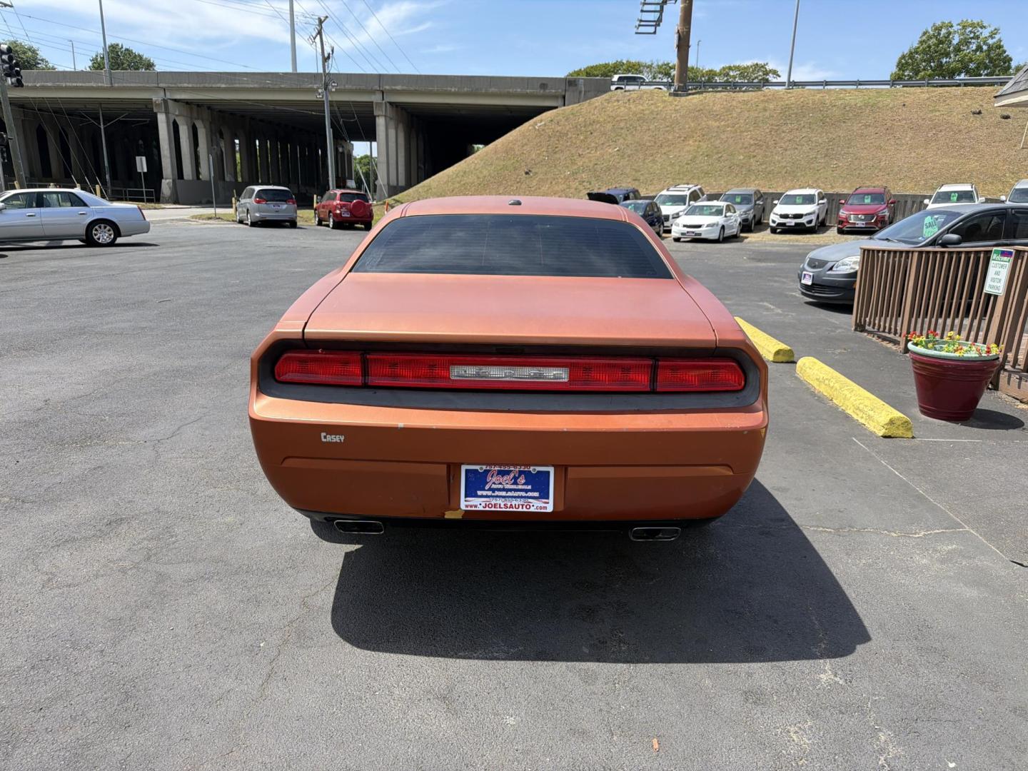 2012 Orange /black Dodge Challenger SXT (2C3CDYAG3CH) with an 3.6L V6 DOHC 24V engine, 4-Speed Automatic transmission, located at 5700 Curlew Drive, Norfolk, VA, 23502, (757) 455-6330, 36.841885, -76.209412 - Photo#2