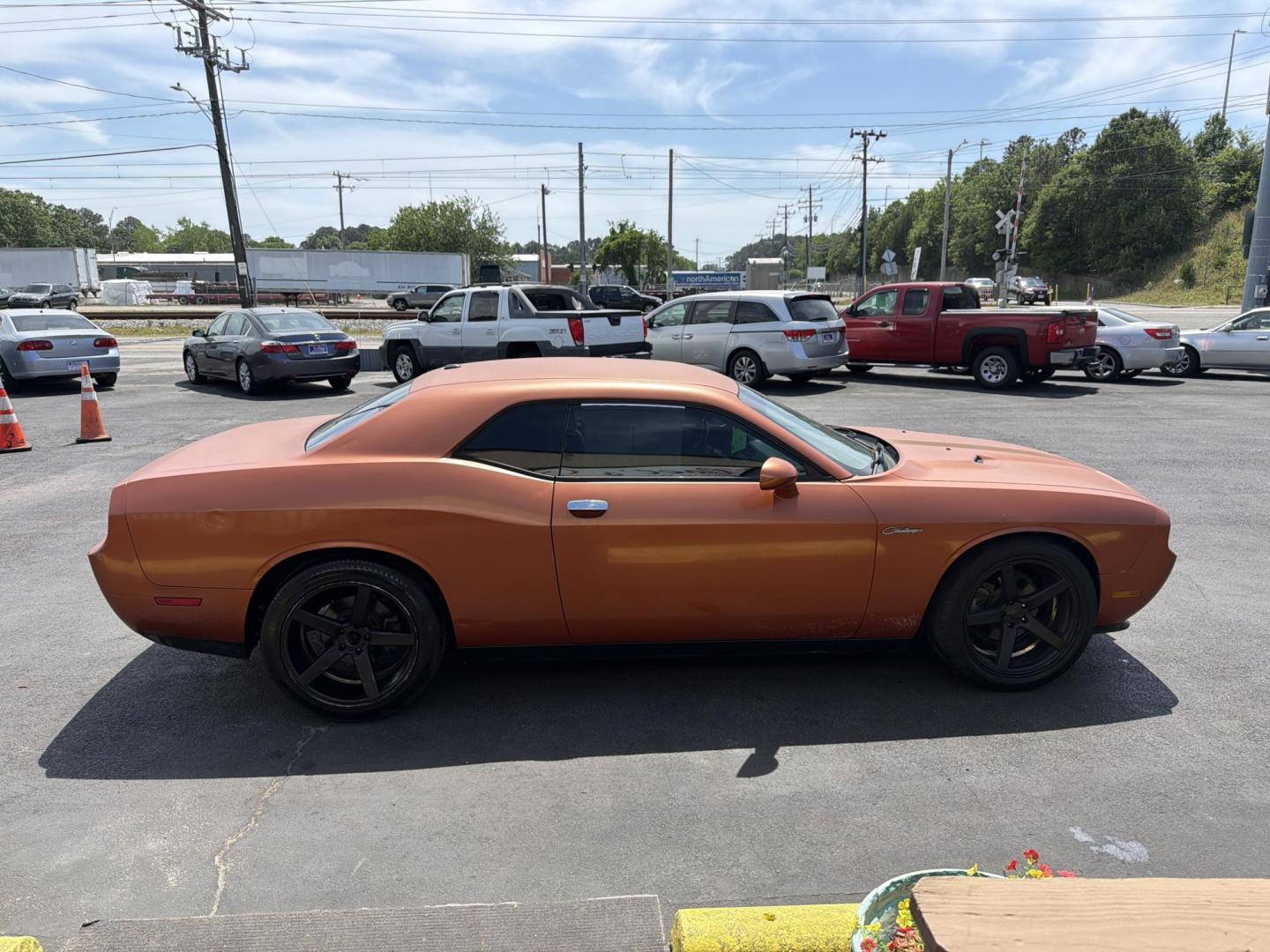 2012 Orange /black Dodge Challenger SXT (2C3CDYAG3CH) with an 3.6L V6 DOHC 24V engine, 4-Speed Automatic transmission, located at 5700 Curlew Drive, Norfolk, VA, 23502, (757) 455-6330, 36.841885, -76.209412 - Photo#3