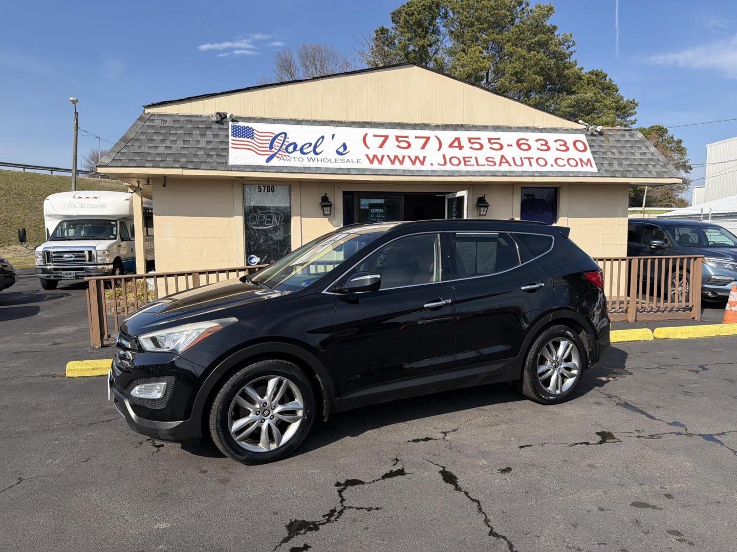 2013 Black Hyundai Santa Fe Sport 2.0 AWD (5XYZUDLA0DG) with an 2.0L L4 DOHC 16V engine, 6-Speed Automatic transmission, located at 5700 Curlew Drive, Norfolk, VA, 23502, (757) 455-6330, 36.841885, -76.209412 - Photo#0