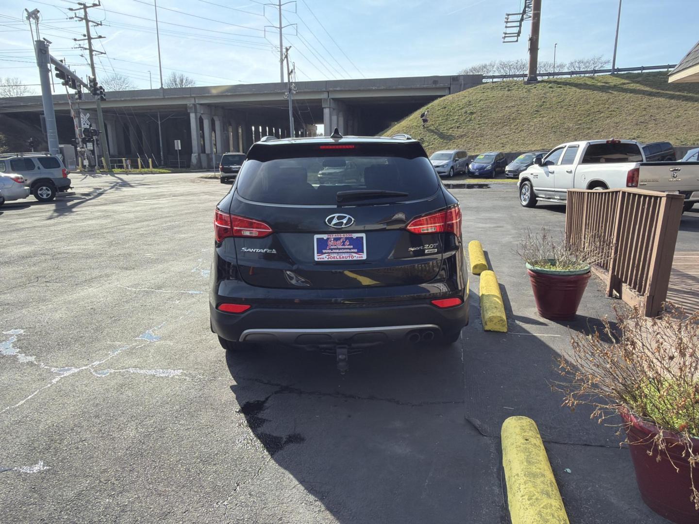 2013 Black Hyundai Santa Fe Sport 2.0 AWD (5XYZUDLA0DG) with an 2.0L L4 DOHC 16V engine, 6-Speed Automatic transmission, located at 5700 Curlew Drive, Norfolk, VA, 23502, (757) 455-6330, 36.841885, -76.209412 - Photo#2