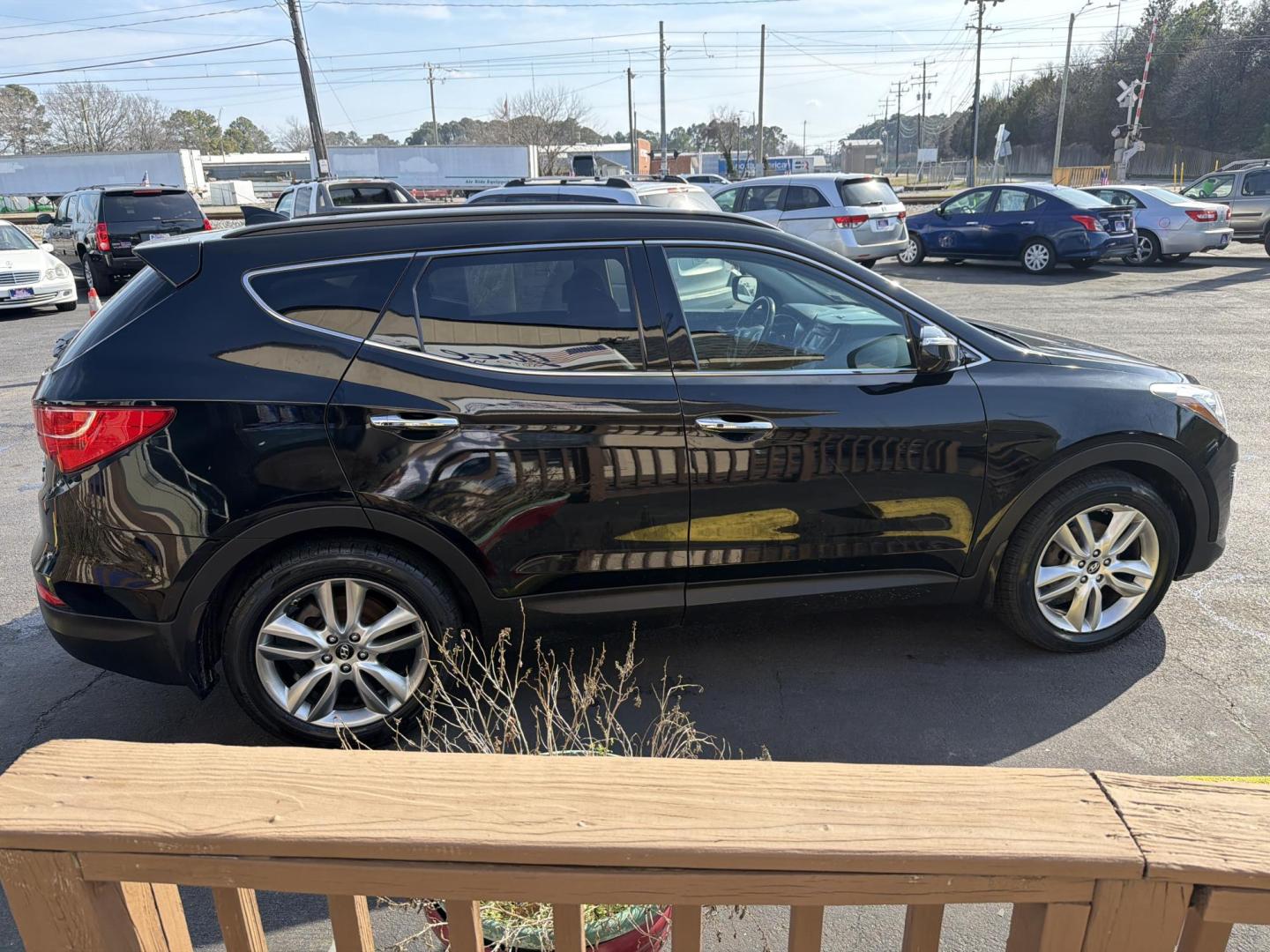 2013 Black Hyundai Santa Fe Sport 2.0 AWD (5XYZUDLA0DG) with an 2.0L L4 DOHC 16V engine, 6-Speed Automatic transmission, located at 5700 Curlew Drive, Norfolk, VA, 23502, (757) 455-6330, 36.841885, -76.209412 - Photo#3