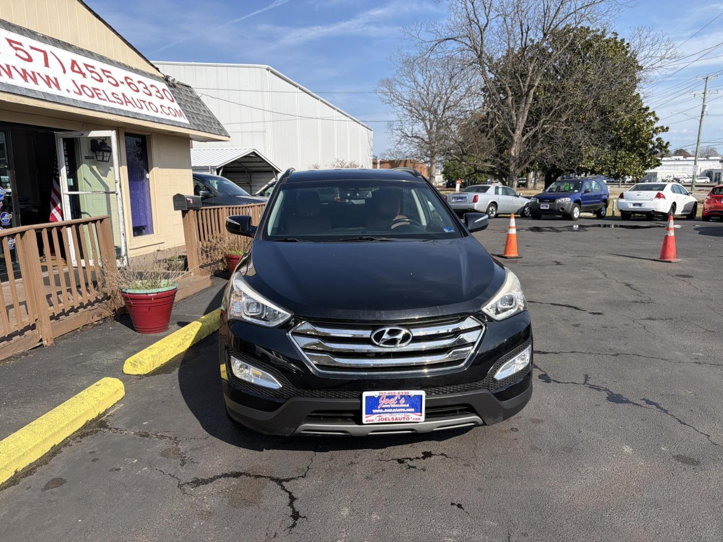 2013 Black Hyundai Santa Fe Sport 2.0 AWD (5XYZUDLA0DG) with an 2.0L L4 DOHC 16V engine, 6-Speed Automatic transmission, located at 5700 Curlew Drive, Norfolk, VA, 23502, (757) 455-6330, 36.841885, -76.209412 - Photo#4