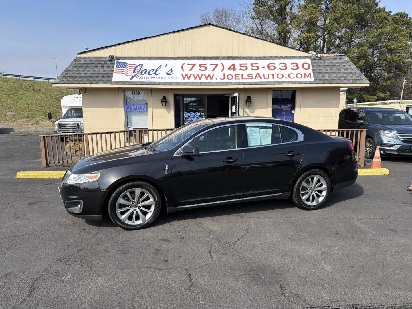 2009 Black Lincoln MKS AWD (1LNHM94R29G) with an 3.7L V6 DOHC 24V engine, 6-Speed Automatic Overdrive transmission, located at 5700 Curlew Drive, Norfolk, VA, 23502, (757) 455-6330, 36.841885, -76.209412 - Photo#0