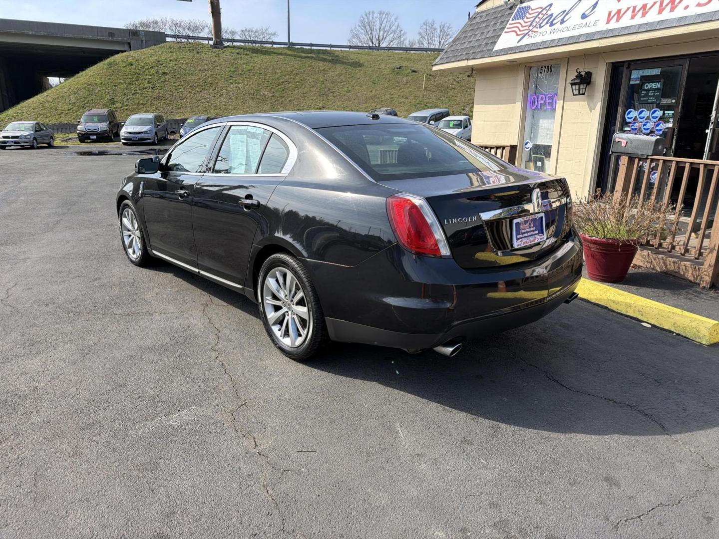 2009 Black Lincoln MKS AWD (1LNHM94R29G) with an 3.7L V6 DOHC 24V engine, 6-Speed Automatic Overdrive transmission, located at 5700 Curlew Drive, Norfolk, VA, 23502, (757) 455-6330, 36.841885, -76.209412 - Photo#1