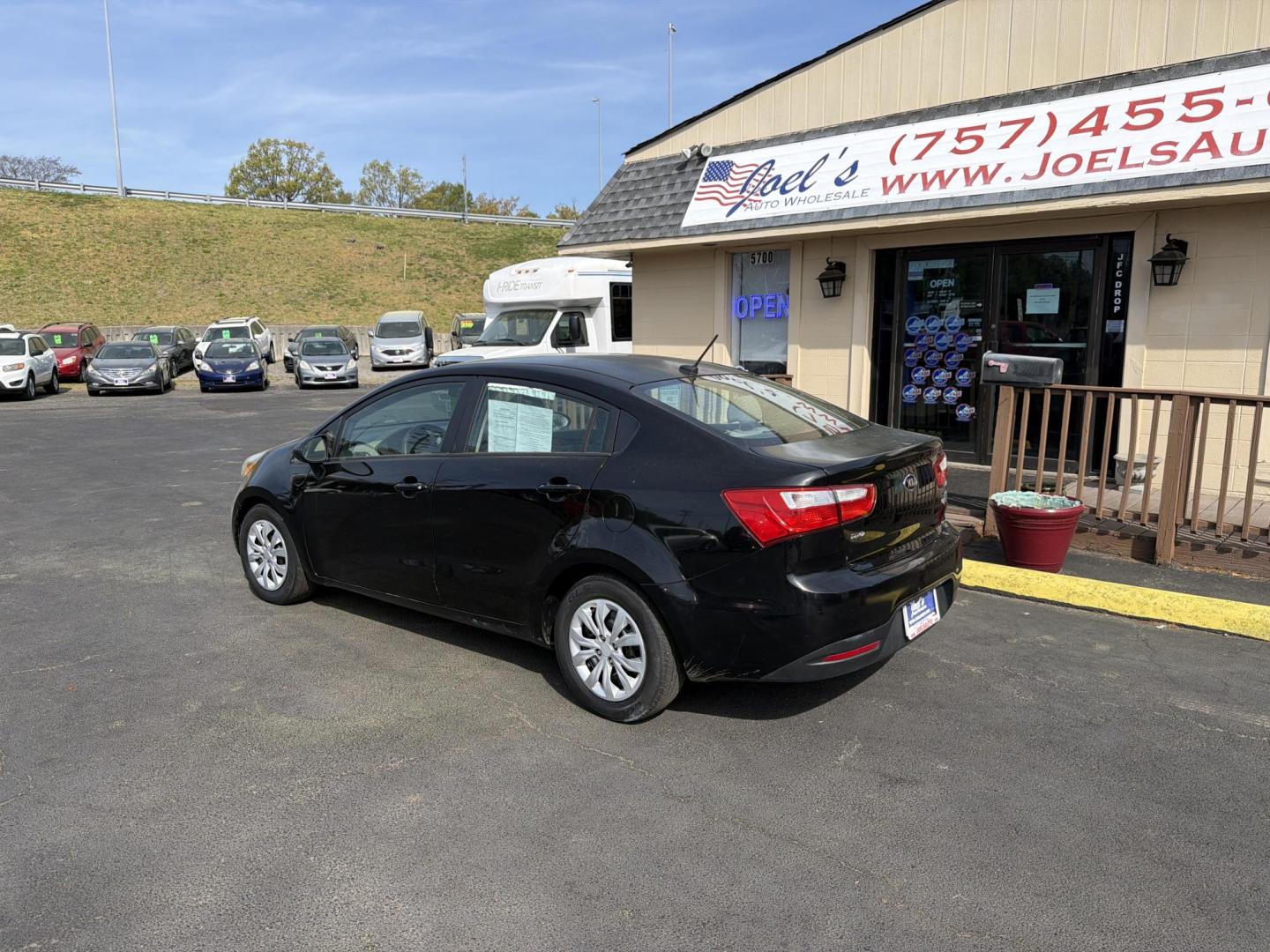 2014 Black Kia Rio LX (KNADM4A32E6) with an 1.6L L4 DOHC 16V engine, 6-Speed Automatic transmission, located at 5700 Curlew Dr., Norfolk, VA, 23502, (703) 554-4373, 36.841885, -76.209412 - Photo#1