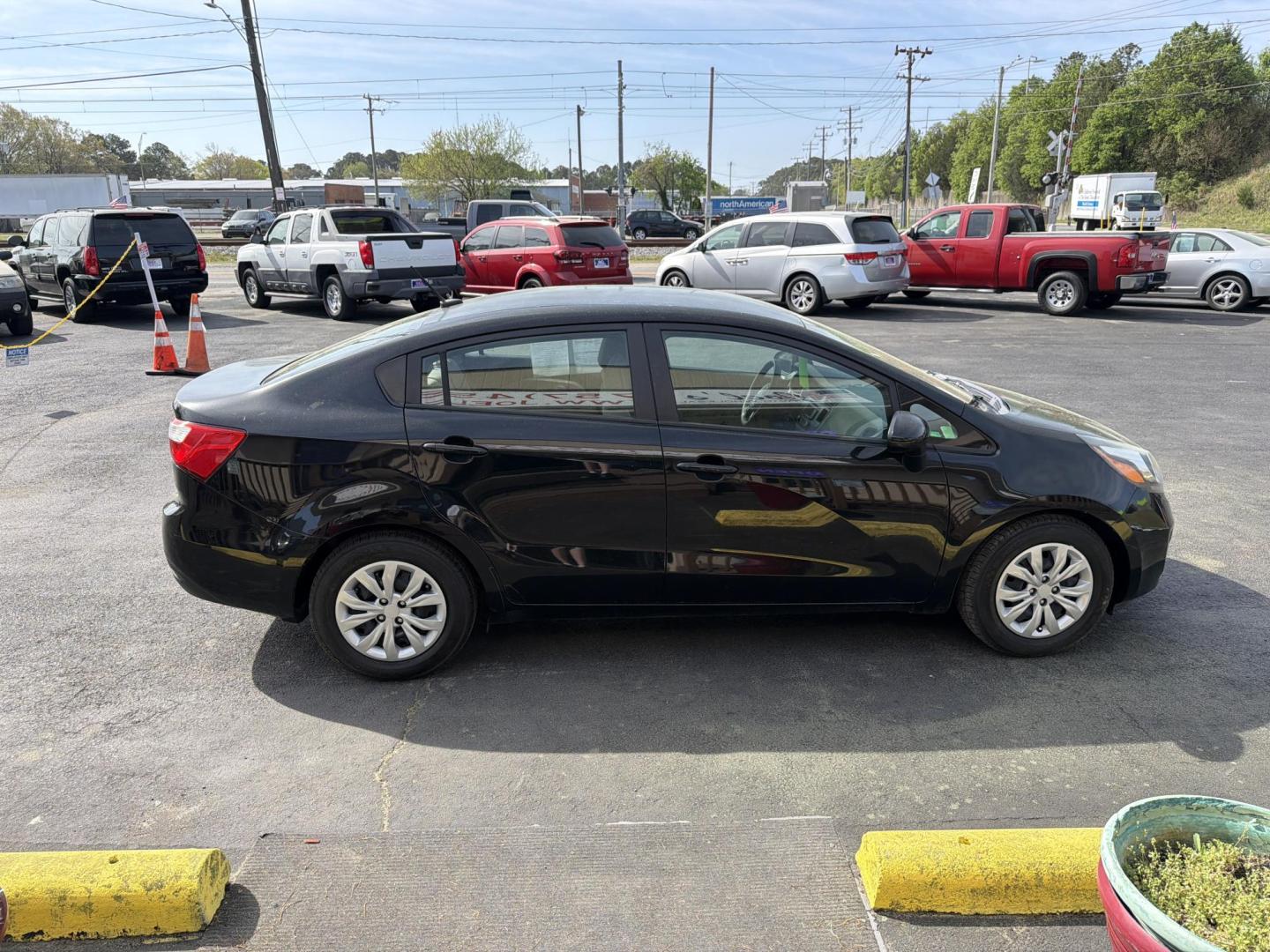 2014 Black Kia Rio LX (KNADM4A32E6) with an 1.6L L4 DOHC 16V engine, 6-Speed Automatic transmission, located at 5700 Curlew Dr., Norfolk, VA, 23502, (703) 554-4373, 36.841885, -76.209412 - Photo#3