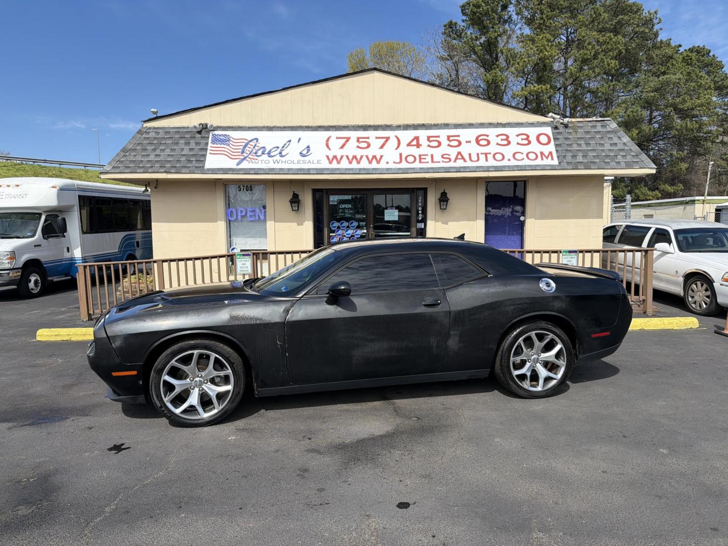 2016 Black Dodge Challenger SXT (2C3CDZAG8GH) with an 3.6L V6 DOHC 24V engine, 5A transmission, located at 5700 Curlew Drive, Norfolk, VA, 23502, (757) 455-6330, 36.841885, -76.209412 - Photo#0