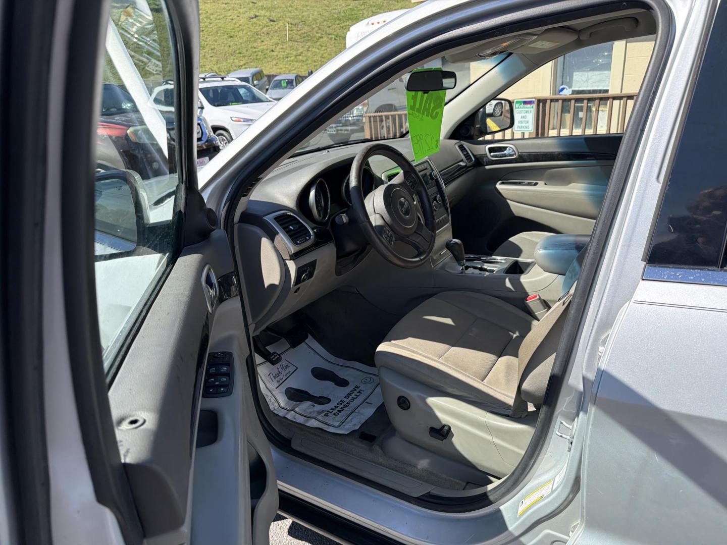 2012 Silver Jeep Grand Cherokee Laredo 4WD (1C4RJFAG8CC) with an 3.6L V6 DOHC 24V engine, 5-Speed Automatic transmission, located at 5700 Curlew Drive, Norfolk, VA, 23502, (757) 455-6330, 36.841885, -76.209412 - Photo#5