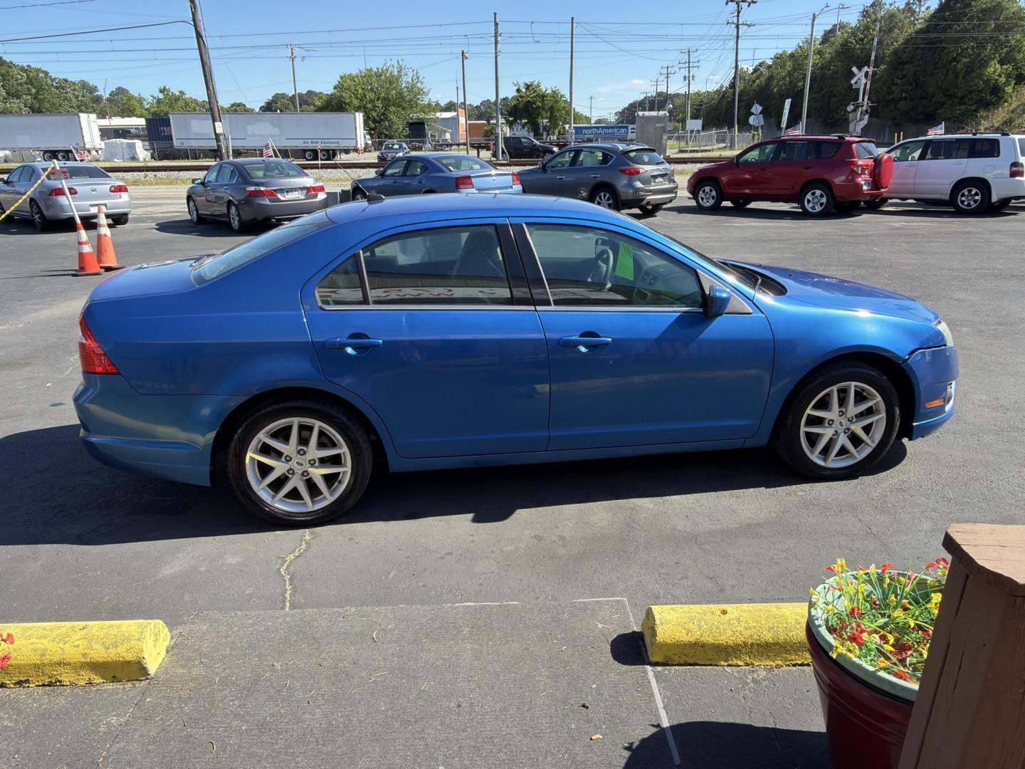 2012 Blue Ford Fusion SEL (3FAHP0JG0CR) with an 3.0L V6 DOHC 24V engine, located at 5700 Curlew Drive, Norfolk, VA, 23502, (757) 455-6330, 36.841885, -76.209412 - Photo#3
