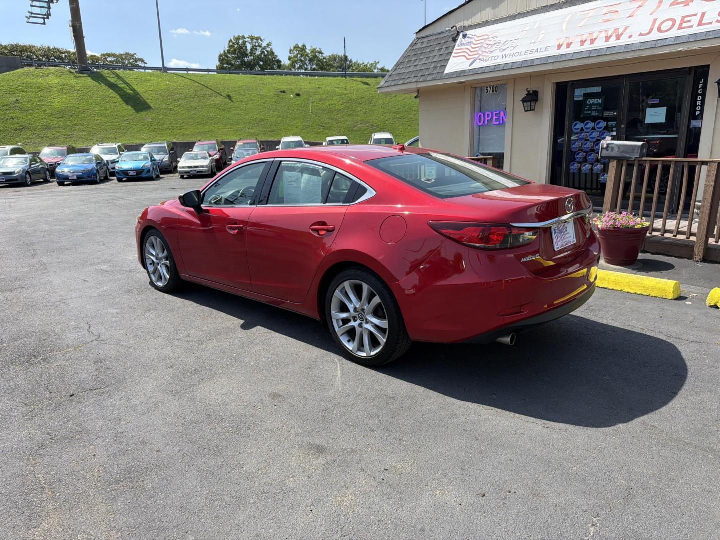 2015 red Mazda Mazda6 i Touring (JM1GJ1V57F1) with an 2.5L L4 DOHC 16V engine, 6-Speed Automatic transmission, located at 5700 Curlew Drive, Norfolk, VA, 23502, (757) 455-6330, 36.841885, -76.209412- Photo#1