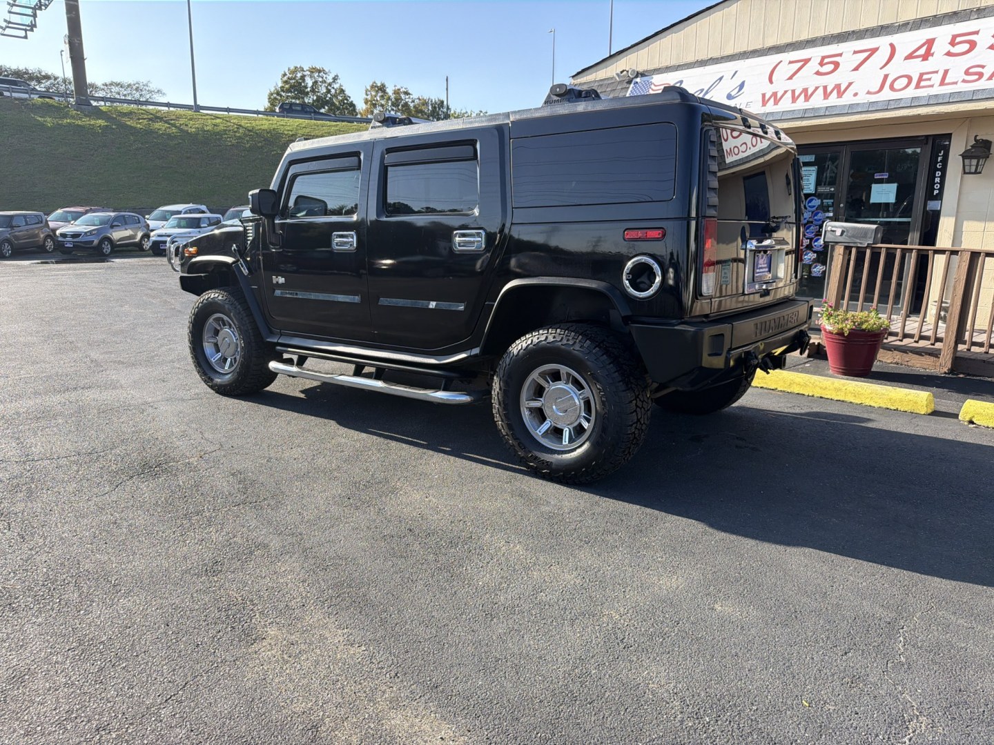 2005 Black Hummer H2 SUV (5GRGN23UX5H) with an 6.0L V8 OHV 16V engine, 4A OD transmission, located at 5700 Curlew Dr., Norfolk, VA, 23502, (703) 554-4373, 36.841885, -76.209412- Photo#1