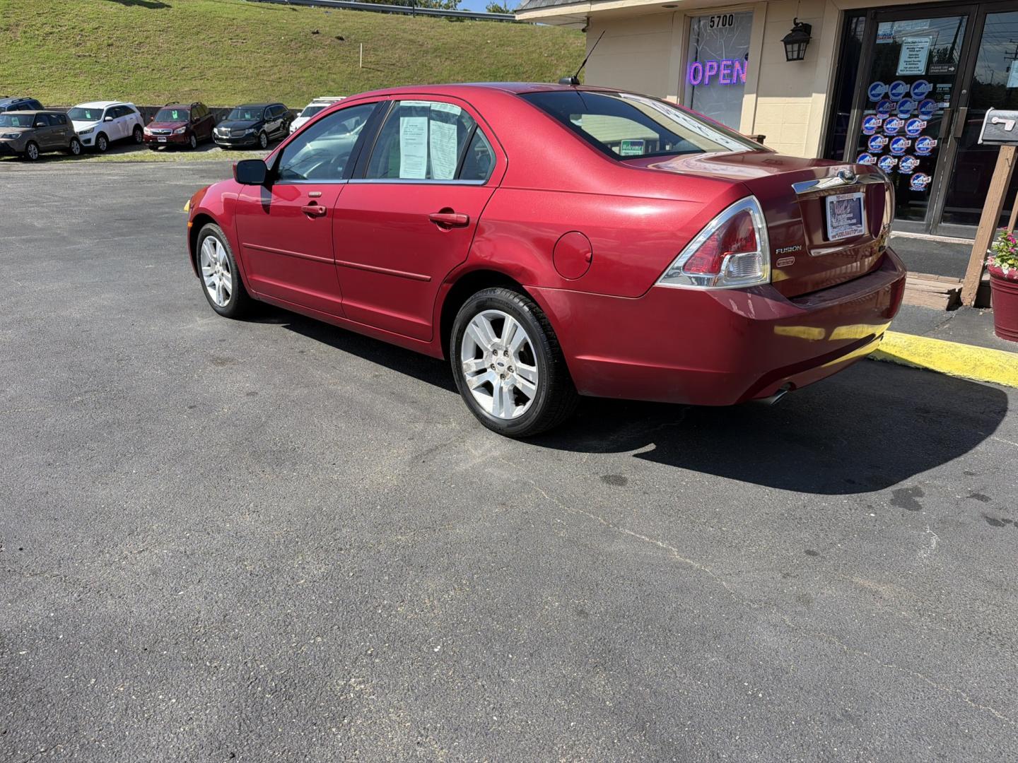 2009 red Ford Fusion V6 SEL (3FAHP08199R) with an 3.0L V6 DOHC 24V engine, 6-Speed Automatic transmission, located at 5700 Curlew Drive, Norfolk, VA, 23502, (757) 455-6330, 36.841885, -76.209412- Photo#1