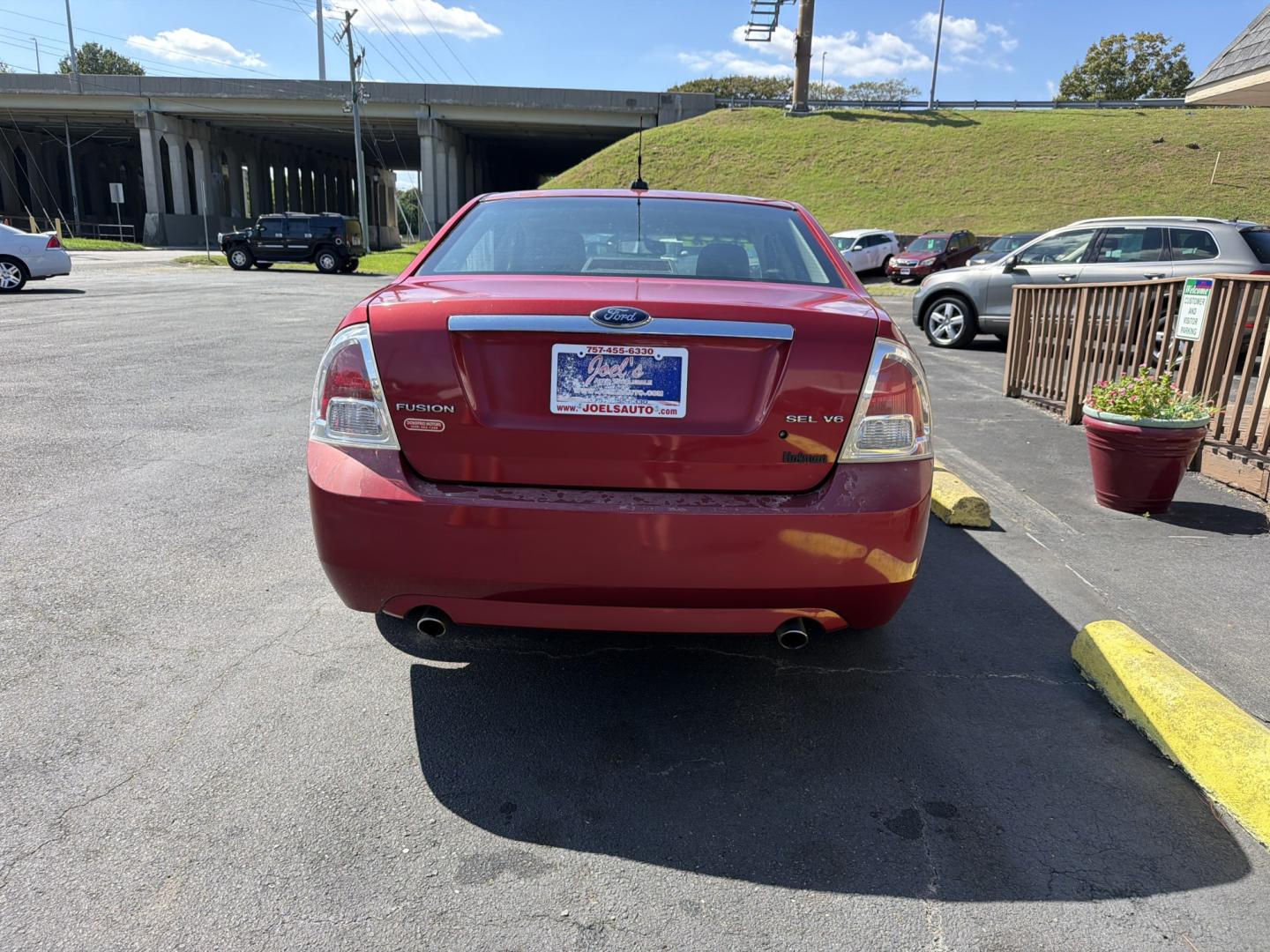 2009 red Ford Fusion V6 SEL (3FAHP08199R) with an 3.0L V6 DOHC 24V engine, 6-Speed Automatic transmission, located at 5700 Curlew Drive, Norfolk, VA, 23502, (757) 455-6330, 36.841885, -76.209412- Photo#2