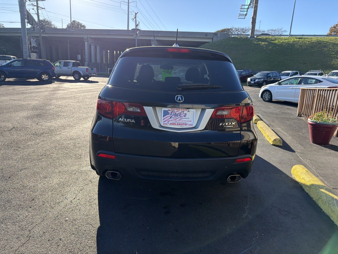 2011 Black Acura RDX 5-Spd AT SH-AWD with Technology Package (5J8TB1H55BA) with an 2.3L L4 DOHC 16V engine, 5A transmission, located at 5700 Curlew Drive, Norfolk, VA, 23502, (757) 455-6330, 36.841885, -76.209412- Photo#2